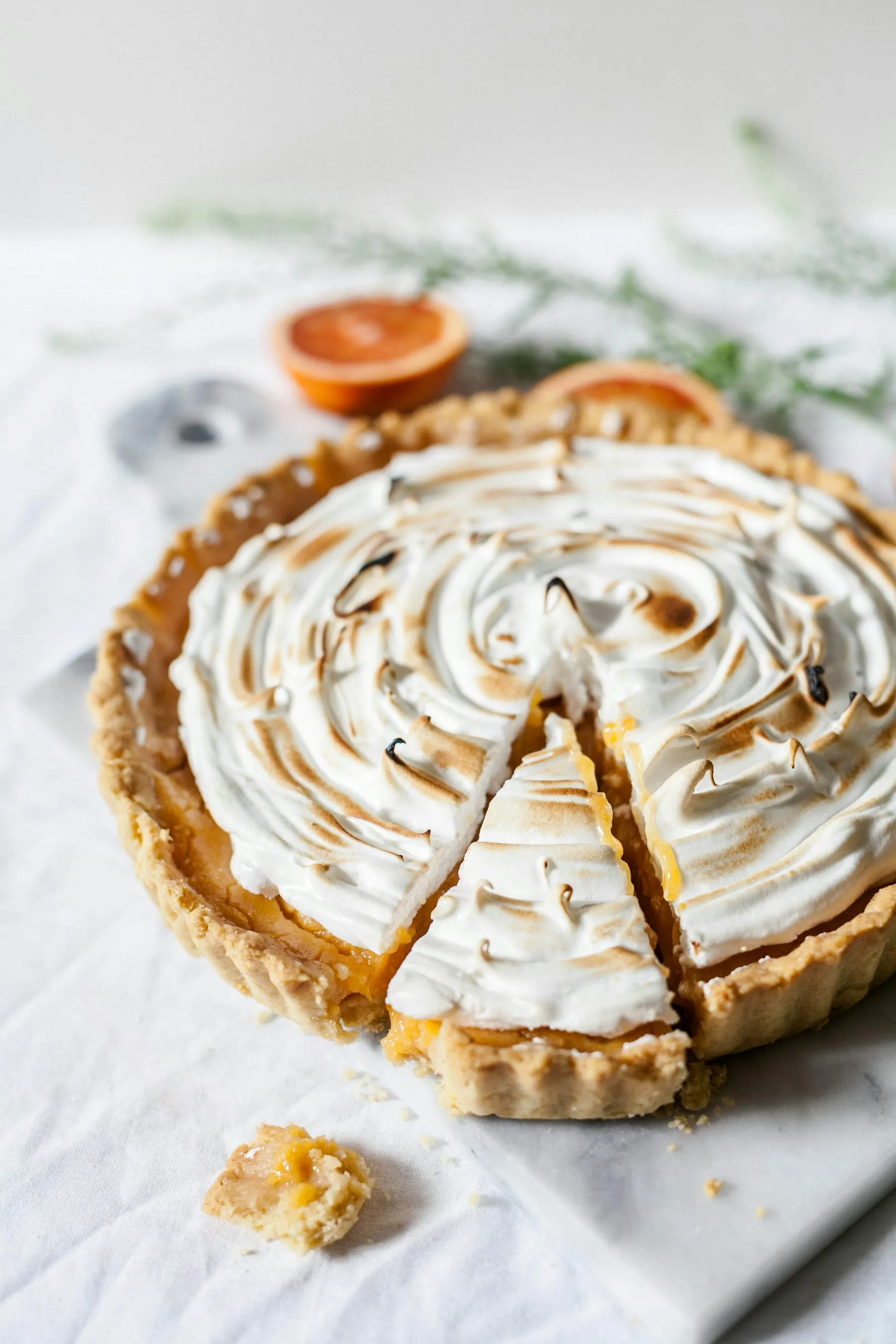 Citrus meringue tart with torched peaks and blood orange